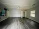 Bright bedroom featuring wood-look floors and painted wall at 5117 Panola Valley Dr, Lithonia, GA 30038