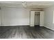 Simple bedroom with wood-look floors and a closet at 5117 Panola Valley Dr, Lithonia, GA 30038