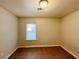 Well-lit bedroom featuring a window and tile floors at 5117 Panola Valley Dr, Lithonia, GA 30038