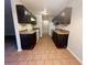 Kitchen with dark cabinets and tiled floor at 5117 Panola Valley Dr, Lithonia, GA 30038