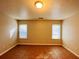 Large living room with tile flooring and two windows at 5117 Panola Valley Dr, Lithonia, GA 30038