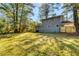 Spacious backyard with lush green grass, providing ample space for outdoor activities and relaxation at 6360 Ashdale Dr, Atlanta, GA 30349