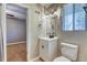 Bathroom featuring a modern vanity with matte black faucet and vanity lighting at 6360 Ashdale Dr, Atlanta, GA 30349
