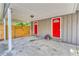 Carport view with two red doors, offering convenient covered parking and easy access at 6360 Ashdale Dr, Atlanta, GA 30349