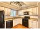 Modern kitchen with granite counters and white cabinets at 6360 Ashdale Dr, Atlanta, GA 30349