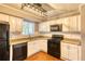 Well-lit kitchen featuring modern appliances and granite countertops at 6360 Ashdale Dr, Atlanta, GA 30349