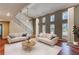 A bright open living room with hardwood floors and many windows at 6360 Ashdale Dr, Atlanta, GA 30349