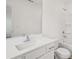 Bright bathroom featuring a single sink vanity, framed mirror and a shower at 7256 Eton Ln, Locust Grove, GA 30248