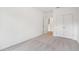 Bright bedroom featuring a carpeted floor, and a closet with double doors at 7256 Eton Ln, Locust Grove, GA 30248