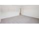 Bright bedroom featuring a carpeted floor and white walls at 7256 Eton Ln, Locust Grove, GA 30248