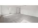 Spacious bedroom with neutral carpet and white walls for a clean, modern aesthetic at 7256 Eton Ln, Locust Grove, GA 30248