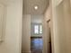 Bright hallway with view into the dining room at 7256 Eton Ln, Locust Grove, GA 30248