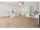 Spacious living space featuring an open floor plan, kitchen, and staircase at 7256 Eton Ln, Locust Grove, GA 30248