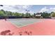 Two well-maintained tennis courts with surrounding fencing at 7256 Eton Ln, Locust Grove, GA 30248