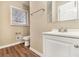 Updated bathroom with white vanity and vinyl flooring at 2280 Connally Ct, Atlanta, GA 30344