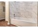 Bathroom with marble tile and a new bathtub at 2280 Connally Ct, Atlanta, GA 30344