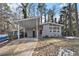 Ranch house with carport, gray brick exterior and landscaping at 2280 Connally Ct, Atlanta, GA 30344