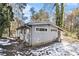 Gray house exterior with snowy yard and wooded backdrop at 2280 Connally Ct, Atlanta, GA 30344