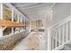 Screened porch with brick flooring and wood planter at 2280 Connally Ct, Atlanta, GA 30344