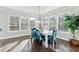 Sunlit dining area with hardwood floors and white table at 4051 Townsend Ln, Atlanta, GA 30346