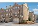 Brick townhome with two-car garage and landscaped front yard at 4051 Townsend Ln, Atlanta, GA 30346