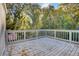 Wooden deck overlooking backyard with trees and shed at 16 S Eugenia Nw Pl, Atlanta, GA 30318