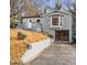 Gray brick ranch home with a bay window, attached garage, and deck at 16 S Eugenia Nw Pl, Atlanta, GA 30318