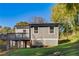 Gray house with a deck and landscaped yard at 16 S Eugenia Nw Pl, Atlanta, GA 30318