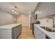 Modern kitchen features gray cabinets, white quartz countertops and stainless steel appliances at 16 S Eugenia Nw Pl, Atlanta, GA 30318