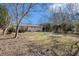 Large backyard with a fenced area and a deck at 2456 Colorado Sw Trl, Atlanta, GA 30331
