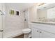 Updated bathroom with granite countertop and shower at 2456 Colorado Sw Trl, Atlanta, GA 30331