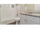Bathroom with white tile shower and granite countertop at 2456 Colorado Sw Trl, Atlanta, GA 30331