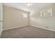Bright bedroom with neutral walls and carpet at 2456 Colorado Sw Trl, Atlanta, GA 30331
