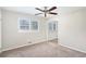 Bright bedroom with neutral walls, carpet, and ceiling fan at 2456 Colorado Sw Trl, Atlanta, GA 30331
