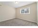 Simple bedroom with neutral walls and carpet at 2456 Colorado Sw Trl, Atlanta, GA 30331