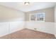 Bright bedroom featuring wainscoting and neutral decor at 2456 Colorado Sw Trl, Atlanta, GA 30331