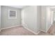 Spacious bedroom with neutral walls, carpet, and large window at 2456 Colorado Sw Trl, Atlanta, GA 30331