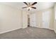 Spacious bedroom with ceiling fan and double doors at 2456 Colorado Sw Trl, Atlanta, GA 30331