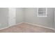 Spacious bedroom with neutral walls and carpet at 2456 Colorado Sw Trl, Atlanta, GA 30331