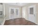 Dining area with hardwood floors, french doors, and access to deck at 2456 Colorado Sw Trl, Atlanta, GA 30331