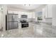 Modern kitchen with white cabinets, granite countertops, and stainless steel appliances at 2456 Colorado Sw Trl, Atlanta, GA 30331