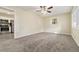 Bright living room with carpet and view into kitchen at 2456 Colorado Sw Trl, Atlanta, GA 30331