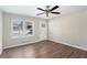 Bright living room with neutral walls, hardwood floors, and brick accent wall at 2456 Colorado Sw Trl, Atlanta, GA 30331