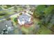 An aerial view showcasing a spacious house with a deck and surrounding landscape at 5060 Rosedown Pl, Roswell, GA 30076