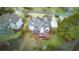 Aerial view of house showcasing backyard, deck and surrounding landscape at 5060 Rosedown Pl, Roswell, GA 30076