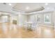 Spacious basement dining area with hardwood floors and recessed lighting at 5060 Rosedown Pl, Roswell, GA 30076