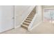 Basement shows carpeted stairs and view into a dining area at 5060 Rosedown Pl, Roswell, GA 30076