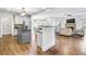 Open kitchen with island, hardwood floors and views to Gathering room at 5060 Rosedown Pl, Roswell, GA 30076