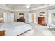 Main bedroom with king-size bed and ample closet space at 5060 Rosedown Pl, Roswell, GA 30076