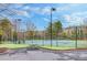 Community tennis courts with ample seating at 5060 Rosedown Pl, Roswell, GA 30076